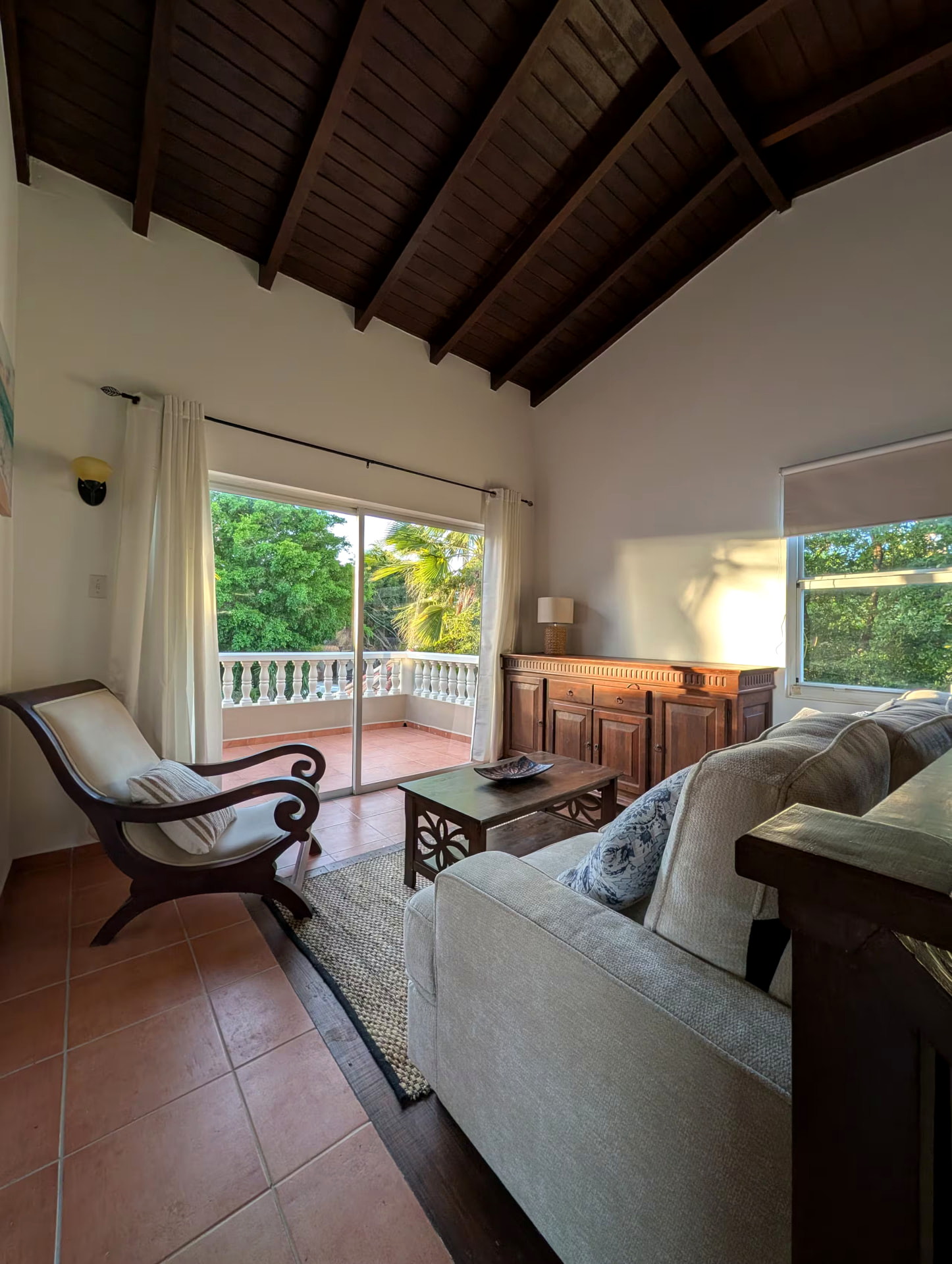 Upstairs sitting area opening onto a private balcony
